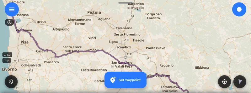 Map in MotoNavigator with the day's traced route: a purple line from the Valdarno through San Casciano in Val di Pesa, Empoli and Cascina, past Pisa and north toward Viareggio.